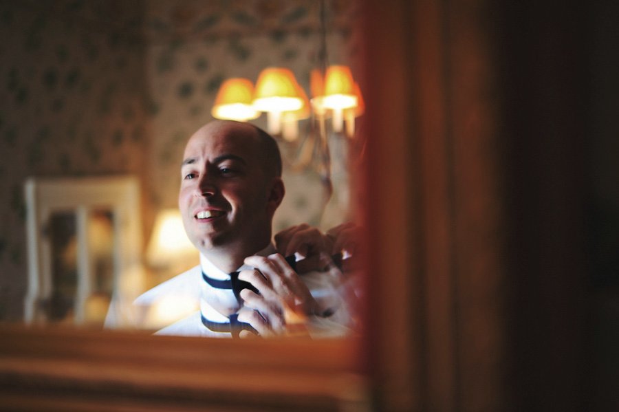 Northern Virginia Wedding Photographer : Thomas Birkby House Wedding : Groomsman puts on a bowtie