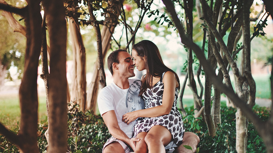 engaged couple sitting in old town alexandria