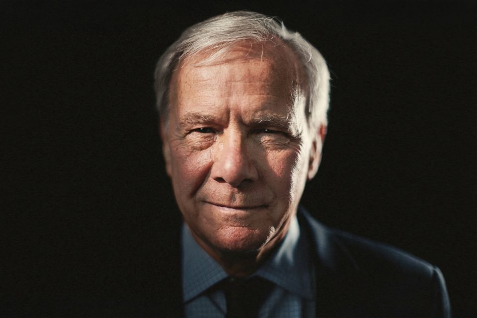 Epic Portrait of Tom Brokaw: An older man with gray hair in a dark suit and tie, facing forward against a shadowy background, his face dramatically illuminated by soft light. Epic Portrait of Tom Brokaw: An older man with gray hair in a dark suit and tie, facing forward against a shadowy background, his face dramatically illuminated by soft light.