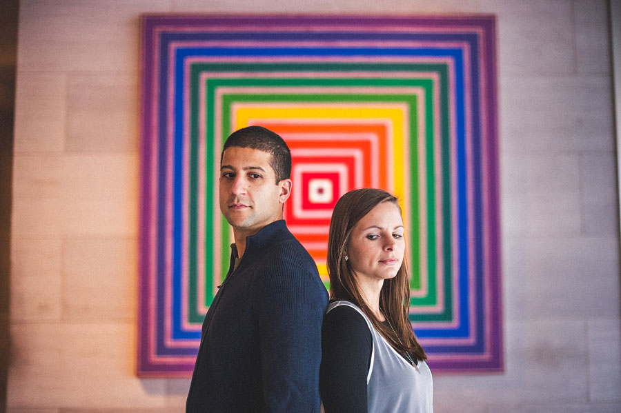 09 colorful engagement photo in front of art 34