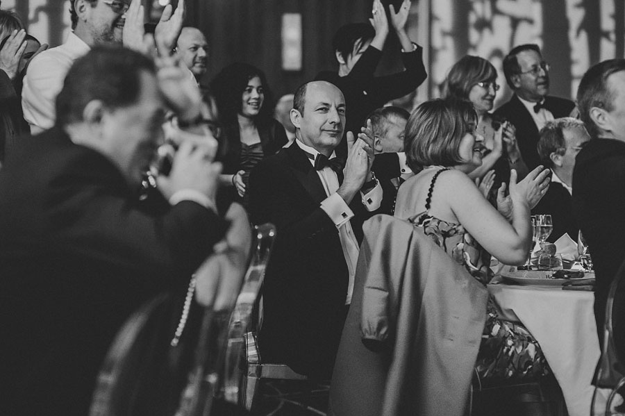 well dressed man clapping