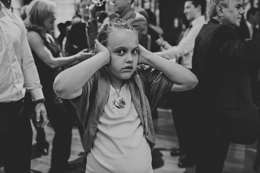 girl hiding ears