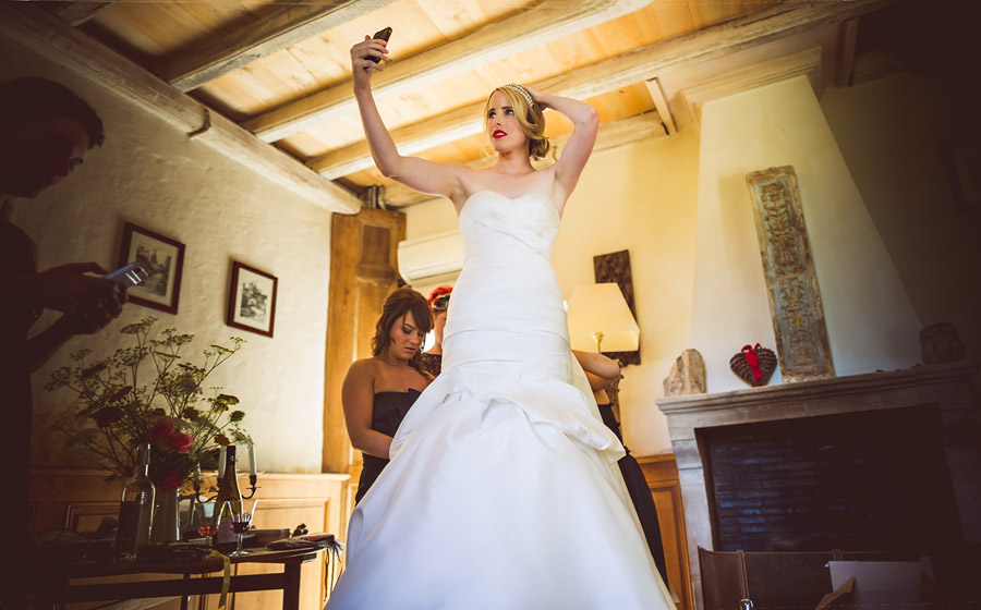 bride checking hair before getting married