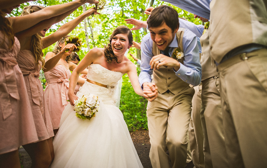 19 bride and groom running underneath people at exit bride and groom running underneath people at exit