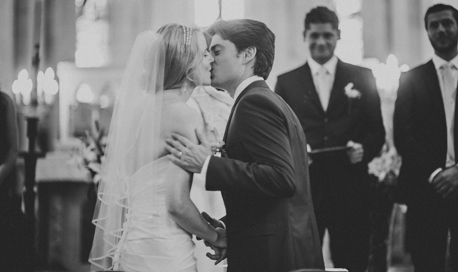 bride and groom first kiss catholic wedding in france