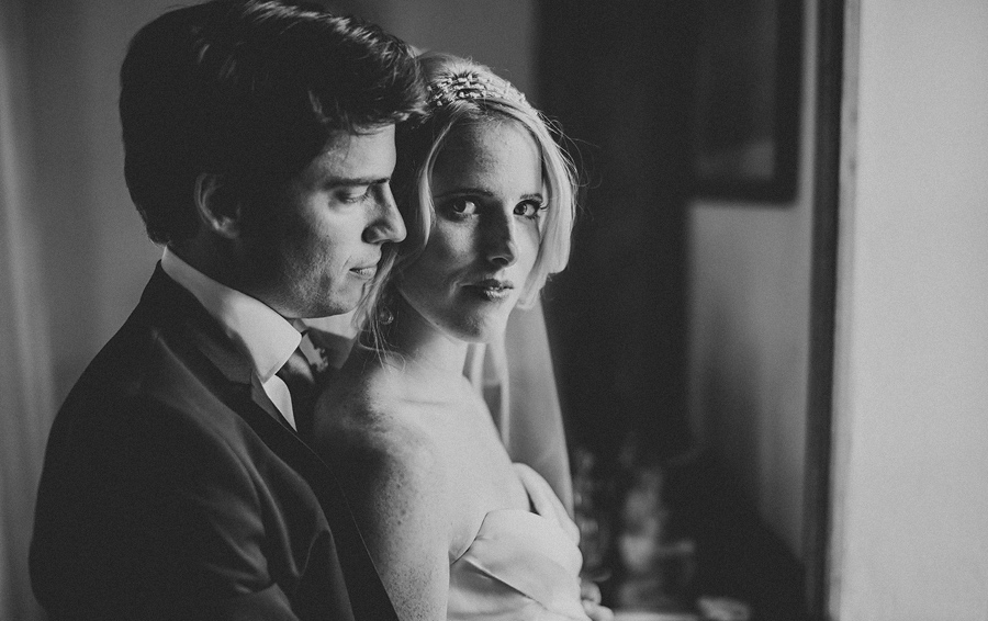 dramatic black and white photo of bride and groom