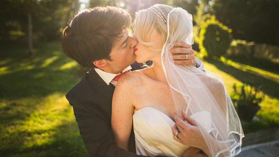 bride and groom kissing intensly