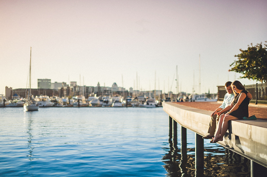 couple sitting together along water