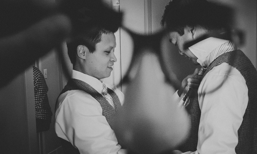 funny groom fixing ties