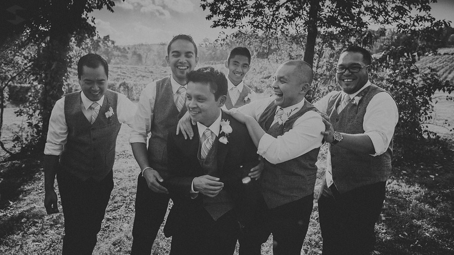 groom laughing with groomsmen