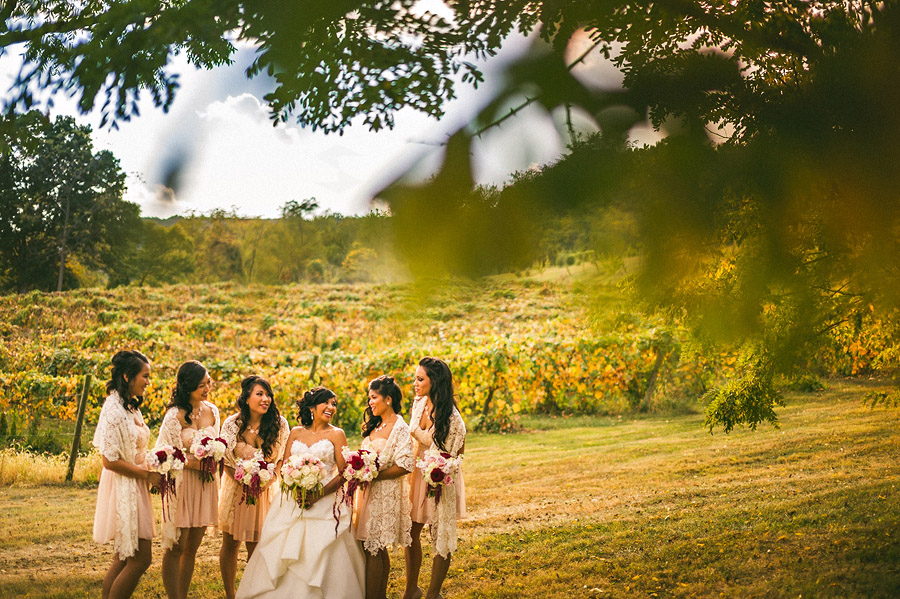 bride laughing with bridesmaids