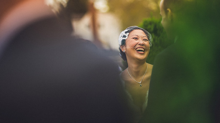 bride laughing during ceremony
