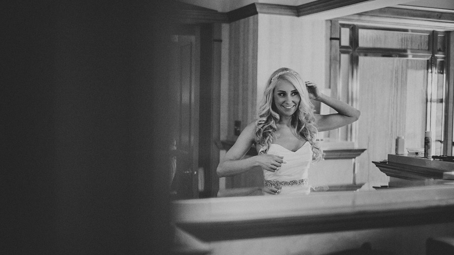 bride checking herself in the mirror