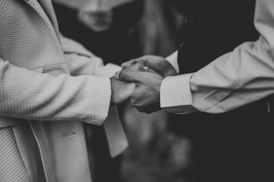 bride and groom holding hands