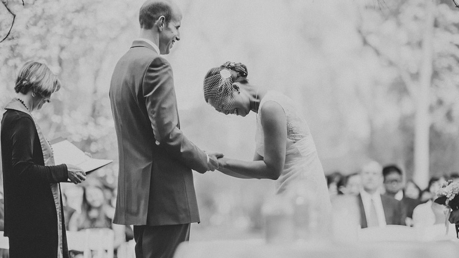 bride laughing really hard during ceremony