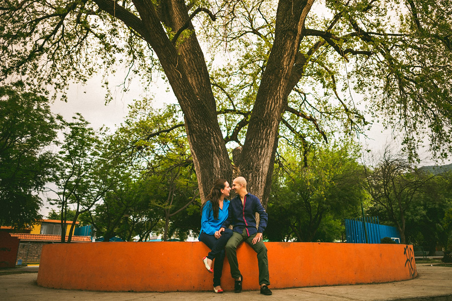 man and woman sitting in park
