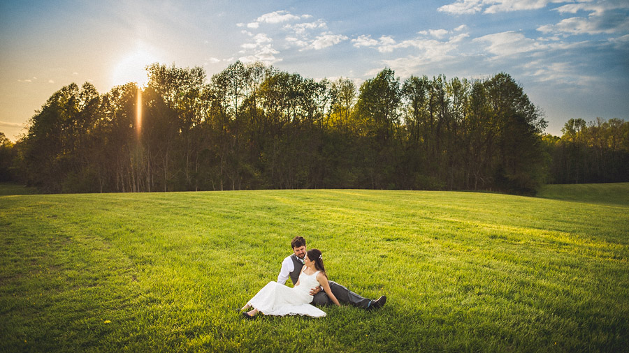 bride and groom in a field