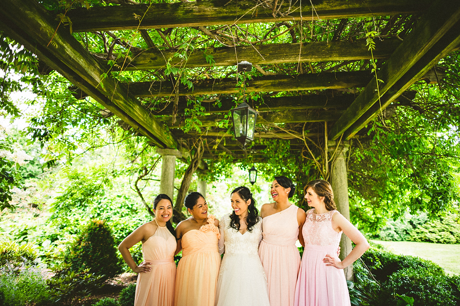 04 bride with her bridesmaids laughing bride with her bridesmaids laughing