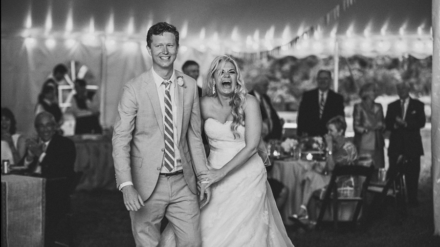 bride and groom entrance laughing