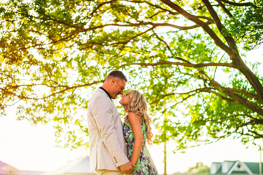 trees at sunset with couple