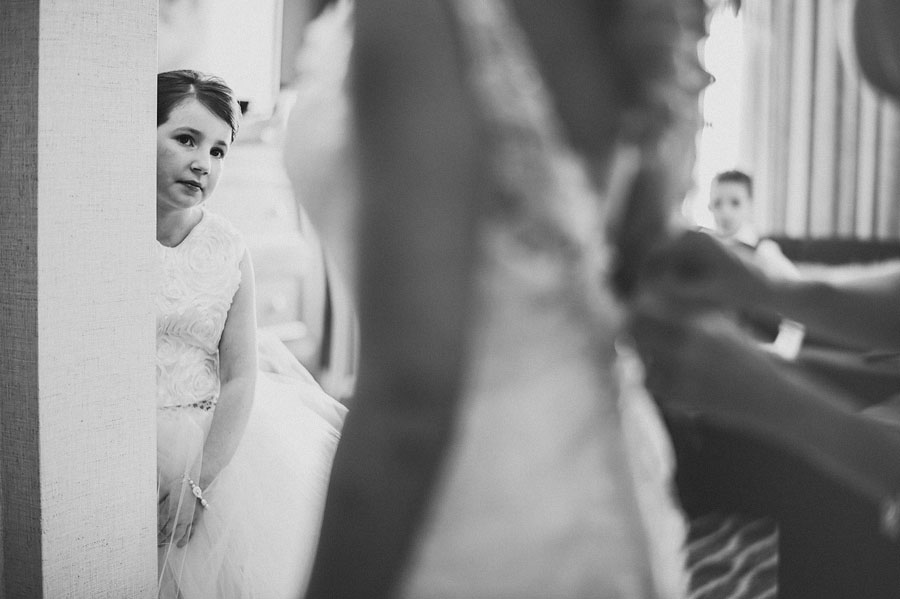girl watching bride get ready