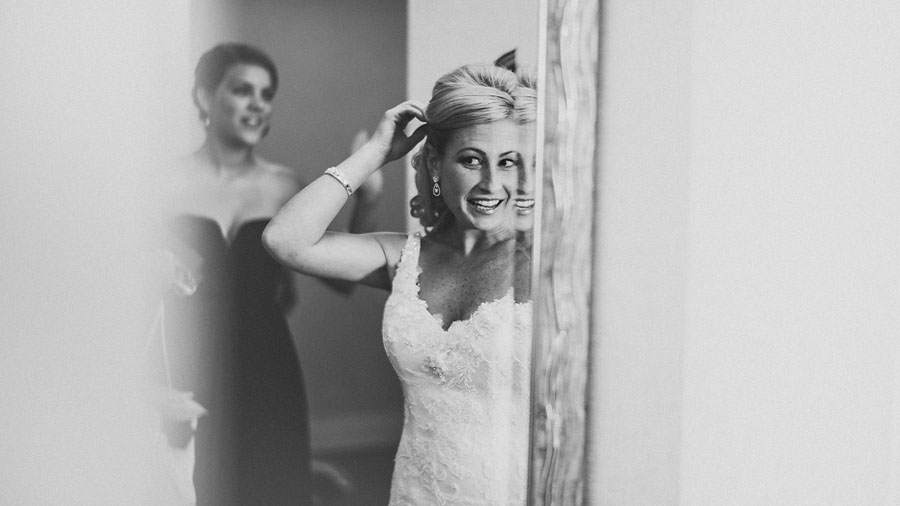 bride checking herself in the mirror