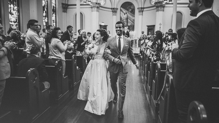 bride and groom walking down aisle