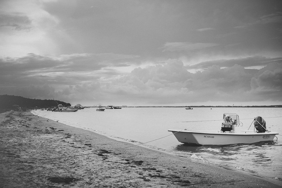 old man sitting on a boat in the water