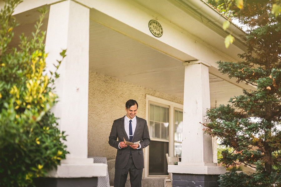 groom reading letter from bride