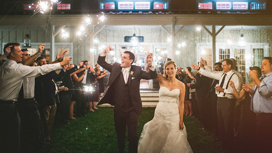 bride and groom exiting with sparklers at veritas winery
