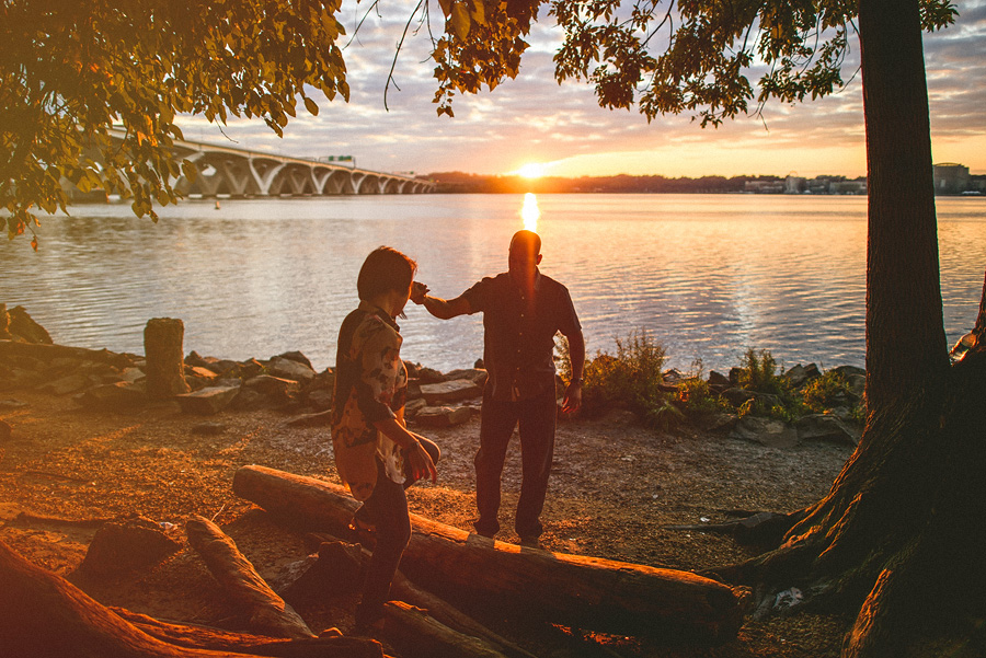 48 couple helping eachother climb over driftwood couple helping eachother climb over driftwood
