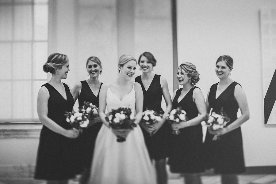 bride with bridesmaids laughing