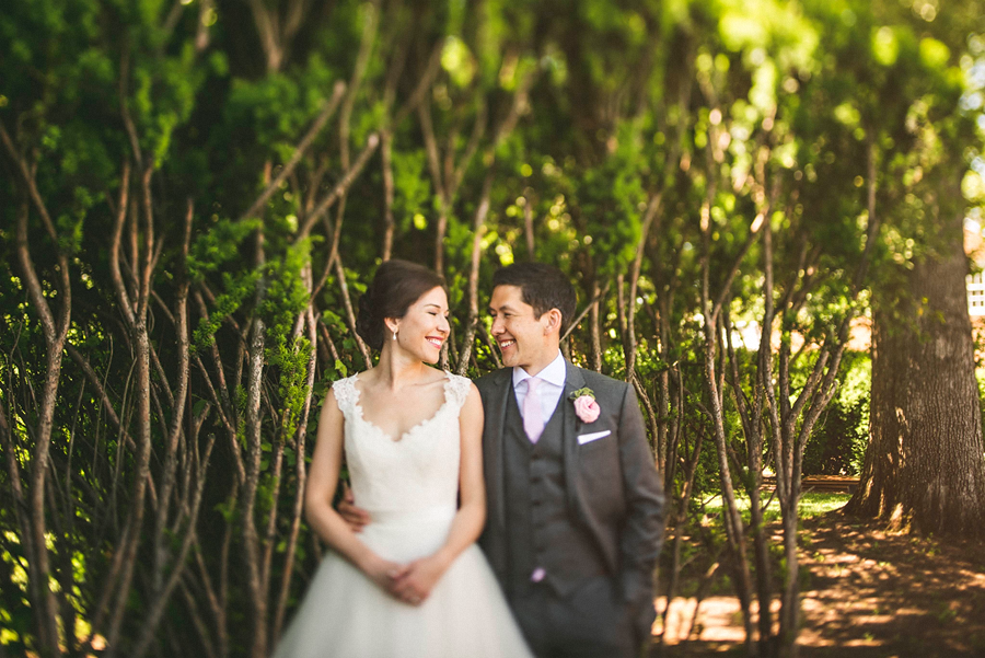 bride and groom smiling with eachother