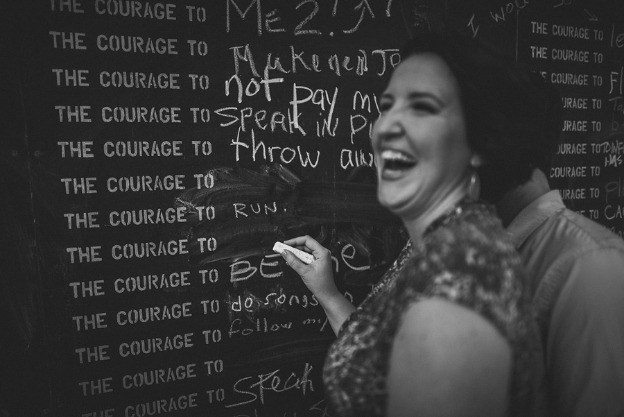 funny moment of a woman drawing on chalk board