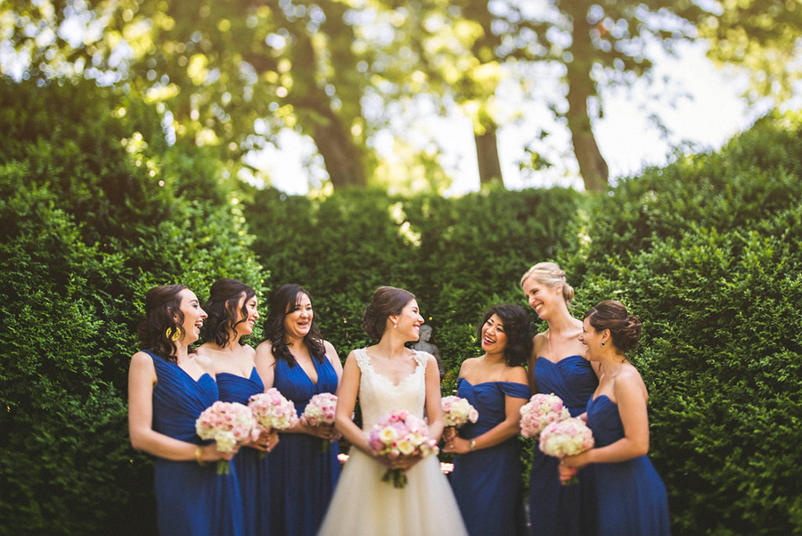 bride laughing with her bridemaids