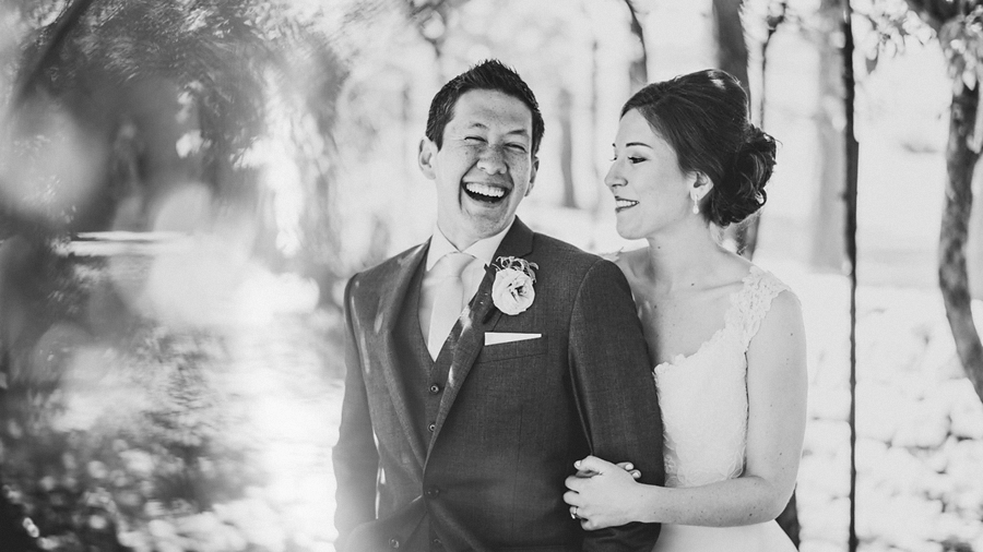 bride and groom laughing