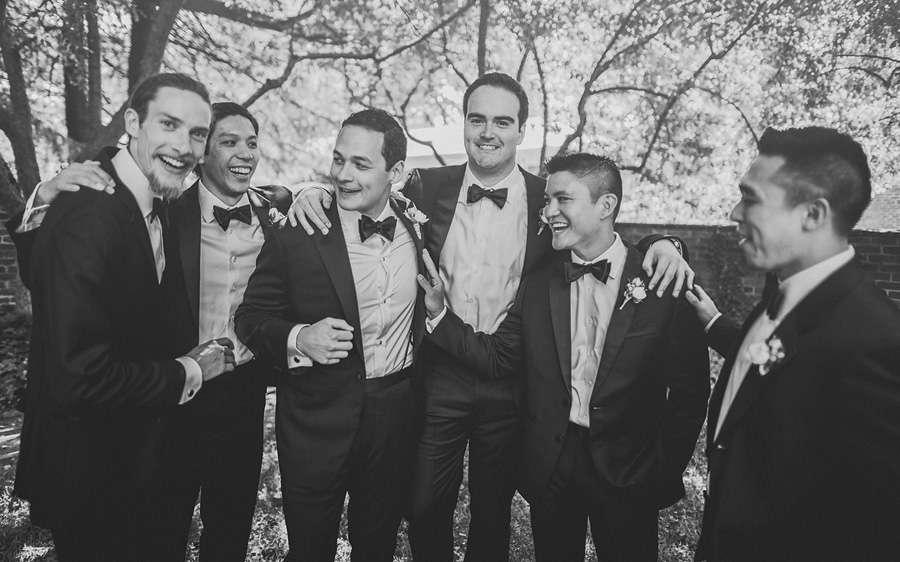 groom laughing with groomsmen
