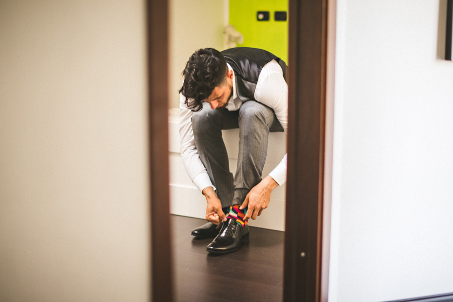 groom tying his shoe