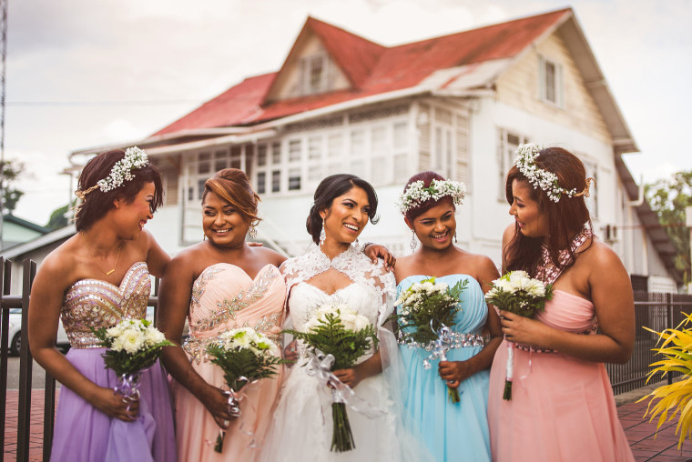 08 bride laughing with bridesmaids