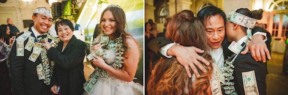 Wedding couple adorned with money leis posing with an older woman; bride and groom emotionally hugging guests at an NYC Wedding reception.