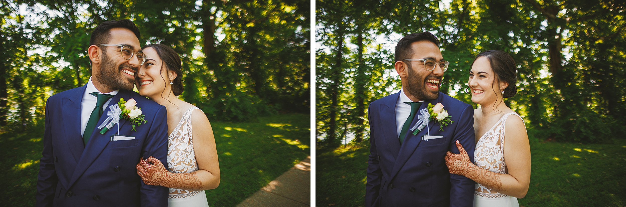 A couple in wedding attire smiles and looks at each other while standing outdoors with lush greenery as their backdrop. The bride, her hands adorned with intricate henna designs, has an Auto Draft of joy in her eyes.
