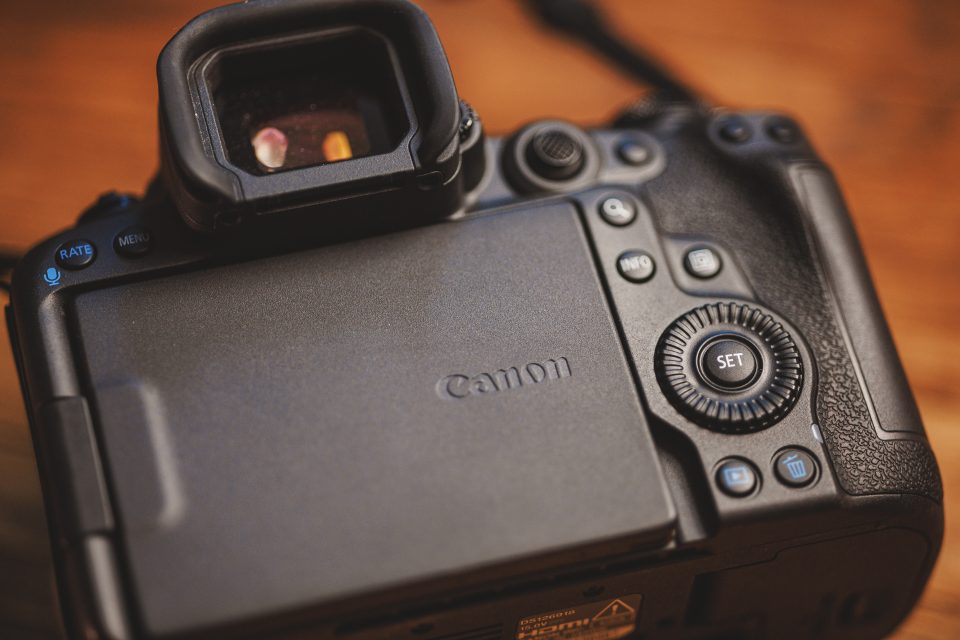 Close-up of the rear view of a Canon camera showing the LCD screen, control buttons, and viewfinder, capturing elements often highlighted in real-world use. This image could easily be part of a detailed Canon R5 Mark ii review after shooting 17k images.