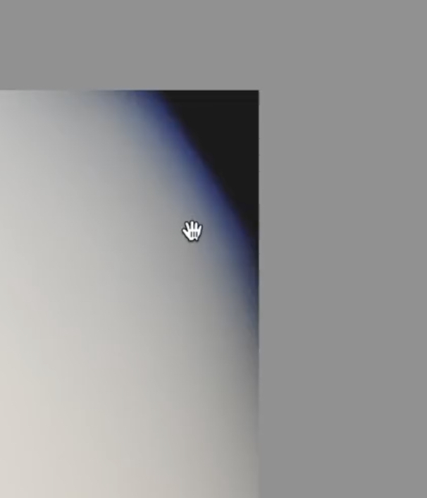 A digital image shows a gradient from light gray at the bottom left to dark blue at the top right, with a hand-shaped cursor in the center and a gray border.